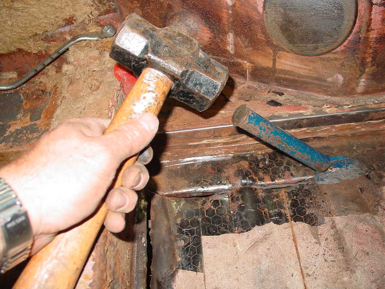 Hammer and chisel was the neatest and safest way of removing the old floors.  No sparks flying from grinding wheels or cutting torches and the finish was neat & tidy.