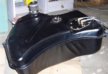 The fuel tank was completely stripped and rebuilt.  The inside was cleaned and protected with POR15 Tank Repair, which seals the metal against rust.  The outside was painted in two pack satin black.